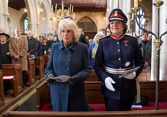 MELKSHAM, ENGLAND - DECEMBER 02: Camilla, Duchess of Cornwall and Lord-Lieutenant of Wilshire, Mrs Sarah Troughton attend a church service during a visit to Wiltshire on December 02, 2021 in Melksham, United Kingdom. Camilla, Duchess of Cornwall attends a short service of Rededication and lays flowers to mark the 100th anniversary of the Seend War Memorial at The Church of The Holy Cross. (Photo by Finnbarr Webster - WPA Pool/Getty Images)