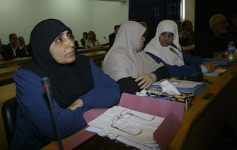 GAZA CITY, :  From left to right-: Parliamentarians Jamila al-Shanti, Mariam Farhat and Huda Naem attend the weekly session of Palestinian Parliament in Gaza City, 21 March 2006. The refusal of Hamas to recognize the supremacy of the Palestinian Liberation Organization was among the main factors behind the refusal of other Palestinian factions such as Fatah and the Popular Front for the Liberation of Palestine to join a Hamas-led coalition government. AFP PHOTO/MOHAMMED ABED  (Photo credit should read MOHAMMED ABED/AFP via Getty Images)