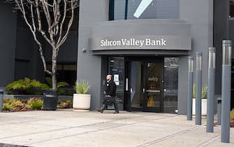 SANTA CLARA, CA - MARCH 10: A person leaves from Silicon Valley Bank headquarters in Santa Clara, California, United States on March 10, 2023.US regulators have shut down Silicon Valley Bank (SVB) amid its sudden collapse, the Federal Deposit Insurance Corporation (FDIC) announced in a statement on Friday. (Photo by Tayfun Coskun/Anadolu Agency via Getty Images)