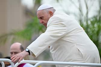 Pope Francis steps down of the popemobile car as he arrives to preside over the Palm Sunday mass on April 2, 2023 at St. Peter's square in The Vatican. (Photo by Filippo MONTEFORTE / POOL / AFP)