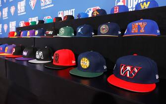 NEW YORK, NEW YORK - JULY 29: A general view of hats on a table during the 2021 NBA Draft at the Barclays Center on July 29, 2021 in New York City. (Photo by Arturo Holmes/Getty Images)