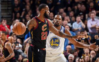 CLEVELAND, OH - JUNE 6: LeBron James #23 of the Cleveland Cavaliers handles the ball against Kevin Durant #35 of the Golden State Warriors during Game Three of the 2018 NBA Finals on June 6, 2018 at Quicken Loans Arena in Cleveland, Ohio. NOTE TO USER: User expressly acknowledges and agrees that, by downloading and or using this Photograph, user is consenting to the terms and conditions of the Getty Images License Agreement. Mandatory Copyright Notice: Copyright 2018 NBAE (Photo by Andrew D. Bernstein/NBAE via Getty Images)