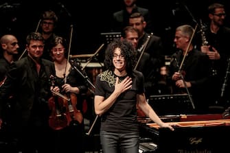 MILAN, ITALY - May 18: Italian pianist and composer Giovanni Allevi performs for AIRC, with Opera Choir of Parma and the Italian Symphony Orchestra on May 18, 2016 in Milan, Italy. (Photo by Sergione Infuso /Corbis via Getty Images)