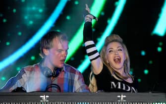 MIAMI, FL - MARCH 24: Avicii is joined by Madonna at Day Two of Ultra Music Festival 14 at Bayfront Park on March 24, 2012 in Miami, Florida. (Photo by Tim Mosenfelder/Getty Images)