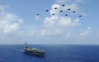 Handout photo dated July 2, 2013 shows F/A-18C Hornets assigned to the Wildcats of Strike Fighter Squadron (VFA) 131 fly over the aircraft carrier USS Dwight D. Eisenhower (CVN 69) during Carrier Air Wing (CVW) 7’s fly-off in the Atlantic Ocean. The Pentagon has ordered a second carrier strike group to the eastern Mediterranean Sea and is sending Air Force fighter jets to the region as Israel prepares to expand its Gaza operations, US Defense Secretary Lloyd Austin said in a statement Saturday. U.S. Navy photo by Mass Communication Specialist 2nd Class Ryan D. McLearnon via ABACAPRESS.COM