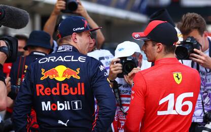 BARCELONA, SPAIN - MAY 21: Pole position qualifier Charles Leclerc of Monaco and Ferrari and Second placed qualifier Max Verstappen of the Netherlands and Oracle Red Bull Racing talk in parc ferme during qualifying ahead of the F1 Grand Prix of Spain at Circuit de Barcelona-Catalunya on May 21, 2022 in Barcelona, Spain. (Photo by Dan Istitene - Formula 1/Formula 1 via Getty Images)