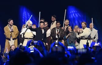 LONDON, ENGLAND - APRIL 09: Ewan McGregor with fans on stage during the Obi-Wan Kenobi panel at Star Wars Celebration in London at ExCel on April 09, 2023 in London, England. (Photo by Jeff Spicer/Getty Images for Disney)