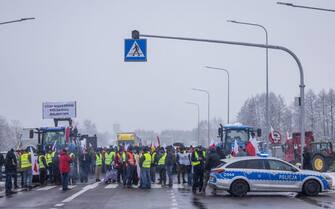 Farmers with tractors block the access to the Polish-Ukrainian border crossing in Dorohusk, eastern Poland, on February 9, 2024, during a farmers' protest across the country against EU politics and Ukrainian agricultural products allowed on EU market at low prices. (Photo by Wojtek Radwanski / AFP) (Photo by WOJTEK RADWANSKI/AFP via Getty Images)