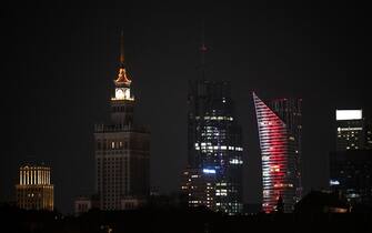 This photograph taken in Warsaw on March 22, 2025 shows the Palace of Culture and Science (L) with its illumination switched off to mark the Earth Hour environmental campaign organised by the World Wild Fund for Nature (WWF) to raise awareness on environmental issues. (Photo by Sergei GAPON / AFP)