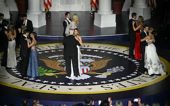 US President Donald Trump and First Lady Melania Trump, Vice President J.D. Vance and his wife Usha Vance, Ivanka Trump and her husband Jared Kushner, Eric Trump and his wife Lara Trump, Donald Trump Jr. and his daughter Kai Madison Trump, Barron Trump and his cousin, dance during the Starlight inaugural ball at the Walter E. Washington Convention Center in Washington, DC, on January 20, 2025. (Photo by Jim WATSON / AFP) / “The erroneous mention[s] appearing in the metadata of this photo by Jim WATSON has been modified in AFP systems in the following manner: [Starlight] instead of [Liberty]. Please immediately remove the erroneous mention[s] from all your online services and delete it (them) from your servers. If you have been authorized by AFP to distribute it (them) to third parties, please ensure that the same actions are carried out by them. Failure to promptly comply with these instructions will entail liability on your part for any continued or post notification usage. Therefore we thank you very much for all your attention and prompt action. We are sorry for the inconvenience this notification may cause and remain at your disposal for any further information you may require.”