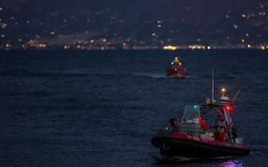 Rescue workers and divers from the Italian fire brigade as a rescue operation continues for the missing people who were on board a sailboat that sank, in Porticello, Sicily Island, Italy, 20 August 2024. At least one person died, six remain missing and 15 passengers were rescued, after a 56-meter-long luxury sailboat, the Bayesian, with 22 people on board, sank on 19 August off Porticello, near Palermo, after a tornado hit the area. The six missing people have not yet been identified as dive teams are trying to find access into the yacht's cabins, sitting at 50 m below the surface of the water.
ANSA/IGOR PETYX