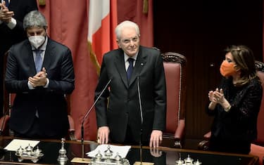 President of the Italian Chamber of Deputies, Roberto Fico (L) and President of the Italian Senate, Maria Elisabetta Alberti Casellati (R) applaud during the swearing-in ceremony of Italian re-elected 13th president Sergio Mattarella (C) at the parliament in Rome's Montecitorio palace on January 3, 2022. - After Italy's bickering political parties failed to agree on a candidate for his successor, and the threat of snap elections reared its head, Mattarella finally agreed for a second term on January 29. (Photo by Filippo MONTEFORTE / AFP) (Photo by FILIPPO MONTEFORTE/AFP via Getty Images)