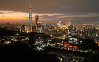 TOPSHOT - This photo taken on November 5, 2018 shows the Taipei skyline at sunset. (Photo by Daniel Shih / AFP)        (Photo credit should read DANIEL SHIH/AFP via Getty Images)