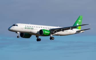 Widerøe Embraer 190 E2 jet airliner plane landing at London Southend Airport, arrival from Bergen for the debut flight of the route as flight WF220
