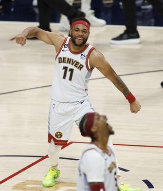 epa10687817 Denver Nuggets forward Bruce Brown (L) celebrates winning the NBA Championship with Denver Nuggets guard Kentavious Caldwell-Pope (R) following the Nuggets win during game five of the NBA Finals over the Miami Heat at Ball Arena in Denver, Colorado, USA, 12 June 2023.  EPA/JOHN G. MABANGLO  SHUTTERSTOCK OUT