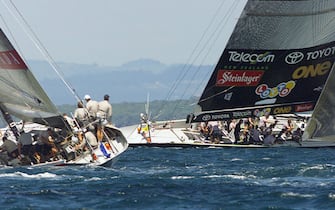 AUC15D:SPORT-YACHTING AMERICAS:AUCKLAND,NEWZEALAND,26FEB00 - Team Prada crewmen watch Team New Zealand as they chase them after rounding the  leeward mark during  race three of the America's Cup against Team New Zealand on Auckland's Hauraki Gulf February 26. Team New Zealand won by 1:39 seconds to lead  3-0 in their first defence of the America's Cup against the Italian's who are endeavoring to become the first European's to win the world's oldest sporting trophy in 149 years, in the best of nine series.    rt/Photo by Rob Taggart    REUTERS