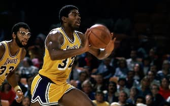 LOS ANGELES - 1981: Magic Johnson #32 of the Los Angeles Lakers moves the ball upcourt during an NBA game at the Forum in Los Angleles, California. NOTE TO USER: User expressly acknowledges  and agrees that, by downloading and or using this  photograph, User is consenting to the terms and conditions of the Getty Images License Agreement.  (Photo by Peter Read Miller/ NBAE/ Getty Images)