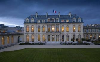 An aerial view taken on March 13, 2019 in Paris shows the Elysee Palace from the garden side with the French President's office (C) at nightfall. (Photo by Eric Feferberg / AFP) (Photo by ERIC FEFERBERG/AFP via Getty Images)