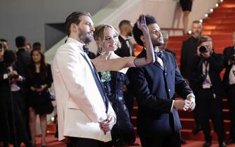 CANNES, FRANCE - MAY 22: (L-R) Sam Levinson, Lily-Rose Depp and Abel “The Weeknd” Tesfaye attend the "The Idol" red carpet during the 76th annual Cannes film festival at Palais des Festivals on May 22, 2023 in Cannes, France. (Photo by Pascal Le Segretain/Getty Images)