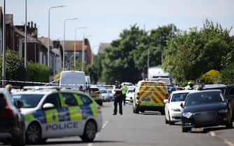 epa11505918 Police at the scene of suspected multiple stabbings in Hart Street in Southport, Britain 29 July 2024. Armed police detained a male and seized a knife after a number of people were injured in a reported stabbing according to Merseyside Police. Eight patients with stab injuries have been treated at the scene so far and have been taken to hospitals, North West Ambulance Service said.  EPA/ADAM VAUGHAN