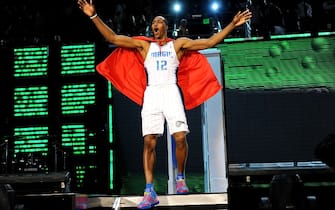 PHOENIX - FEBRUARY 14:  Dwight Howard of the Orlando Magic emerges from a phone booth wearing a Superman cape during the Sprite Slam Dunk Contest on All-Star Saturday Night, part of 2009 NBA All-Star Weekend at US Airways Center on February 14, 2009 in Phoenix, Arizona.  NOTE TO USER: User expressly acknowledges and agrees that, by downloading and or using this photograph, User is consenting to the terms and conditions of the Getty Images License Agreement.  (Photo by Ronald Martinez/Getty Images)