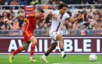AS Roma's Gianluca Mancini (L) vies for the ball with Bologna's Joshua Zirkzee during the Italian Serie A soccer match between AS Roma and Bologna FC 1909 at the Olimpico stadium in Rome, Italy, 22 April 2024.  ANSA/ETTORE FERRARI




