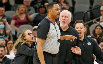 SAN ANTONIO, TX - MARCH 18:  Head coach of the San Antonio Spurs Gregg Popovich is given a second technical as assistant coach Becky Hammon (L) and Mitch Johnson, (R), tried to restrain Popovich as he argued with official Bennie Adams during the game against the New Orleans Pelicans in the first half at AT&T Center on March 18,  2022 in San Antonio, Texas. NOTE TO USER: User expressly acknowledges and agrees that, by downloading and or using this photograph, User is consenting to terms and conditions of the Getty Images License Agreement. (Photo by Ronald Cortes/Getty Images)