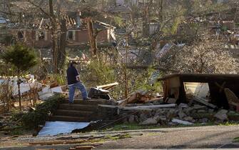 LITTLE ROCK, AR - MARCH 31: A resident inspects the remains of their home on March 31, 2023 in Little Rock, Arkansas. Tornados damaged hundreds of homes and buildings Friday afternoon across a large part of Central Arkansas. Governor Sarah Huckabee Sanders declared a state of emergency after the catastrophic storms that hit on Friday afternoon. According to local reports, the storms killed at least three people. (Photo by Benjamin Krain/Getty Images)