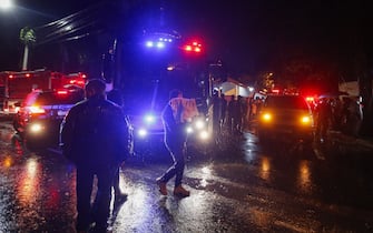 Police cars and a fire truck are seen near the plane crash site in the neighborhood of Capela de Vinhedo, Sao Paulo state, Brazil, Aug. 9, 2024. A passenger plane crashed in the interior of the Brazilian state of Sao Paulo on Friday, killing all 61 aboard, the airline company Voepass confirmed. The black box of the plane had been recovered. Photo by Paulo Pinto/Agencia Brasil via Xinhua/ABACAPRESSC.OM