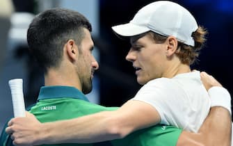 Jannik Sinner of Italy embraces Novak Djokovic of Serbia during the Nitto ATP Finals 2023 tennis tournament at the Pala Alpitour arena in Turin, Italy, 14 November 2023. ANSA/ALESSANDRO DI MARCO