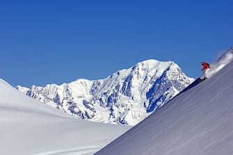 Ski in La Plagne,on the back the Mont Blanc,48O7 meters,France. (Photo by Philippe ROYER/Gamma-Rapho via Getty Images)