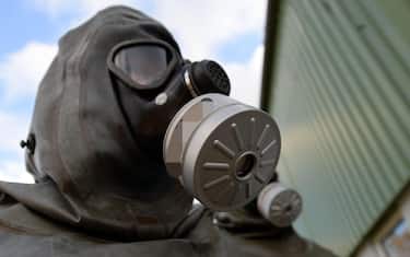 (FILE)   A pyrotechnician of the Society for the disposal of chemical agents and military waste (GEKA) wears a protection mask during a media event in Munster, Germany, 30 October 2013. The GEKA??was founded in 1997 and is the only company in Germany licensed to take care of the disposal of chemical agents.  EPA/PETER STEFFEN