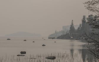 Heavy smoke from nearby wildfires fills the sky along the shoreline on Yellowknife, NT, Canada Bay in Yellowknife, NT, Canada on Tuesday, August 15, 2023.Photo by Angela Gzowski/CP/ABACAPRESS.COM