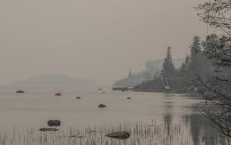 Heavy smoke from nearby wildfires fills the sky along the shoreline on Yellowknife, NT, Canada Bay in Yellowknife, NT, Canada on Tuesday, August 15, 2023.Photo by Angela Gzowski/CP/ABACAPRESS.COM