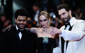(From L) Canadian singer Abel Makkonen Tesfaye aka The Weeknd, French-US actress and model Lily-Rose Depp and US director Sam Levinson arrive for the screening of the film "The Idol" during the 76th edition of the Cannes Film Festival in Cannes, southern France, on May 22, 2023. (Photo by CHRISTOPHE SIMON / AFP) (Photo by CHRISTOPHE SIMON/AFP via Getty Images)