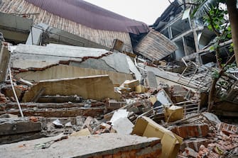 epa11256548 The wreckage of a printing company s factory after it collapsed following a magnitude 7.5 earthquake in New Taipei, Taiwan, 03 April 2024. A magnitude 7.4 earthquake struck Taiwan on the morning of 03 April with an epicenter 18 kilometers south of Hualien City at a depth of 34.8 km, according to the United States Geological Survey (USGS).  EPA/DANIEL CENG