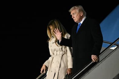 US President Donald Trump and First Lady Melania Trump step off Air Force One upon arrival at Leonardo da Vinci International Airport in Rome on April 25, 2025. Trump is in Rome to attend the funeral for Pope Francis. (Photo by Mandel NGAN / AFP)