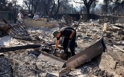 epa11817723 A person, who requested not be identified, sorts through the remains of his mother s home in Altadena, California, USA, 10 January 2025. Multiple wildfires continue to burn across thousands of acres in Southern California, destroying thousands of homes and forcing people to evacuate areas throughout the Los Angeles area. According to the California Governor s office, more than 7,500 firefighting and emergency personnel are involved in response efforts.  EPA/CAROLINE BREHMAN
