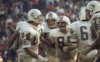 LOS ANGELES - JANUARY 14:  Linebacker Nick Buoniconti #85 (C) pumps up teammates (L-R) Bill Stanfill #84, Mike Kolen #57 and Larry Little #66 of the Miami Dolphins defensive line during Super Bowl VIII against the Washington Redskins at Memorial Coliseum in Los Angeles, California on January 14, 1973. The Dolphins defeated the Redskins 14-7. (Photo by Focus On Sport/Getty Images)