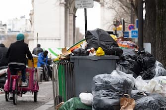 This photograph taken in Paris, on March 13, 2023, shows  waste that has been piling up on the pavement as waste collectors are on strike since March 6 against the French government's proposed pensions reform. (Photo by ALAIN JOCARD / AFP) (Photo by ALAIN JOCARD/AFP via Getty Images)