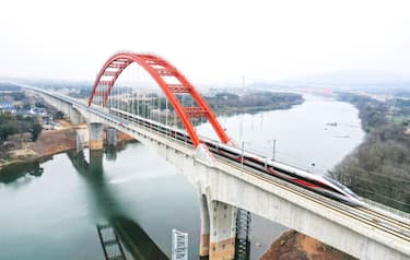 The G4015 high-speed train is running on the Hangzhou-Nanchang High-Speed Railway Changjiang Super Bridge in Nanchang, China, on January 9, 2024. (Photo by Costfoto/NurPhoto via Getty Images)