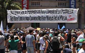 People take part in a demonstration during a national strike against the government of Javier Milei in Cordoba, Argentina on January 24, 2024. Argentine President Javier Milei faces the first national strike in just 45 days of government, against his draconian fiscal adjustment and his plan to reform more than a thousand laws and regulations that governed for decades. The largest Argentine union called the strike in rejection, in particular, of the changes by decree to the labor regime promoted by Milei, which limit the right to strike and affect the financing of unions. (Photo by Nicolas Aguilera / AFP) (Photo by NICOLAS AGUILERA/AFP via Getty Images)