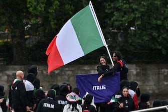 PARIS, FRANCE - JULY 26: Italy athletes aboard a boat in the floating parade on the river Seine during the Opening Ceremony of the Olympic Games Paris 2024 on July 26, 2024 in Paris, France. (Photo by Image Photo Agency/Getty Images)