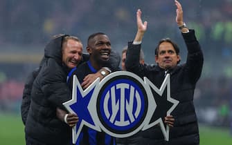 Marcus Thuram of FC Internazionale celebrates the victory of the Serie A 2023/24 title with Simone Inzaghi Head Coach of FC Internazionale during Serie A 2023/24 football match between AC Milan and FC Internazionale at San Siro Stadium, Milan, Italy on April 22, 2024