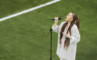 epa11146284 US singer Andra Day performs during pre-game ceremonies at the start of Super Bowl LVIII between the Kansas City Chiefs and the San Fransisco 49ers at Allegiant Stadium in Las Vegas, Nevada, USA, 11 February 2024. The Super Bowl is the annual championship game of the NFL between the AFC Champion and the NFC Champion and has been held every year since 1967.  EPA/CAROLINE BREHMAN