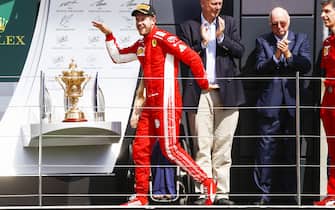 SILVERSTONE, UNITED KINGDOM - JULY 08: Sebastian Vettel, Ferrari, 1st position, walks like an egyptian during the British GP at Silverstone on July 08, 2018 in Silverstone, United Kingdom. (Photo by Glenn Dunbar / LAT Images)