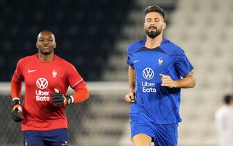 France's (left-right) goalkeeper Steve Mandanda, Olivier Giroud and Matteo Guendouzi during a training session at the Al Sadd Sports Club in Doha, Qatar. Picture date: Tuesday December 6, 2022.