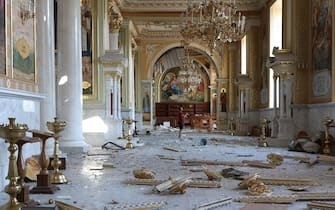 A man stands inside the damaged Transfiguration Cathedral following a missile strike in Odesa, on July 23, 2023, amid the Russian invasion of Ukraine. Ukraine on Sunday said 19 people, including four children, were wounded in a Russian overnight missile attack on Odesa that also killed one person. (Photo by Oleksandr GIMANOV / AFP)