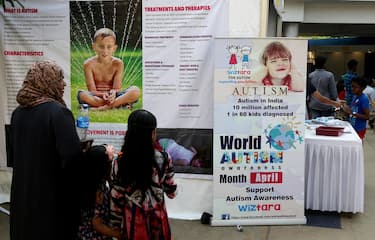 epa06640922 People read an information board during an event on the eve of 'World Autism Awareness Day' organized by 'wiztara trust' NGO in Bangalore, India, 01 April 2018. The UN General Assembly designated 02 April as the World Autism Awareness Day to highlight the need to help improve the quality of life of children and adults, who are affected by autism.  EPA/JAGADEESH NV
