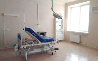 Delivery room with gynecological gurney for childbirth. Modern ward for childbirth. Maternity hospital inside